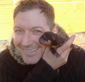 Glenn Holmes and a puppy rottweiler